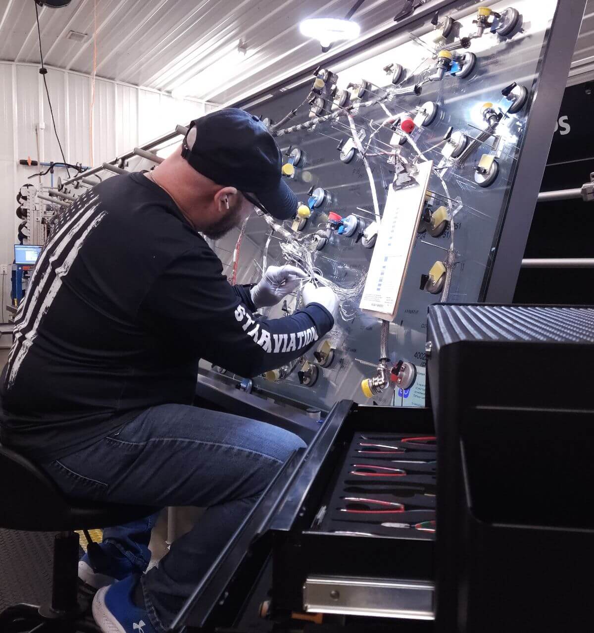 Aircraft technician fixing aircraft electrical system